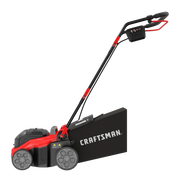 Photo of Craftsman CMCOE210B red and black lawn mower, side angle, showing handle and large rear collection bag.